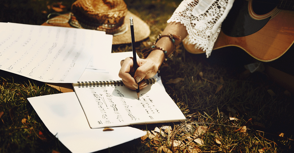 image of girl writing a song